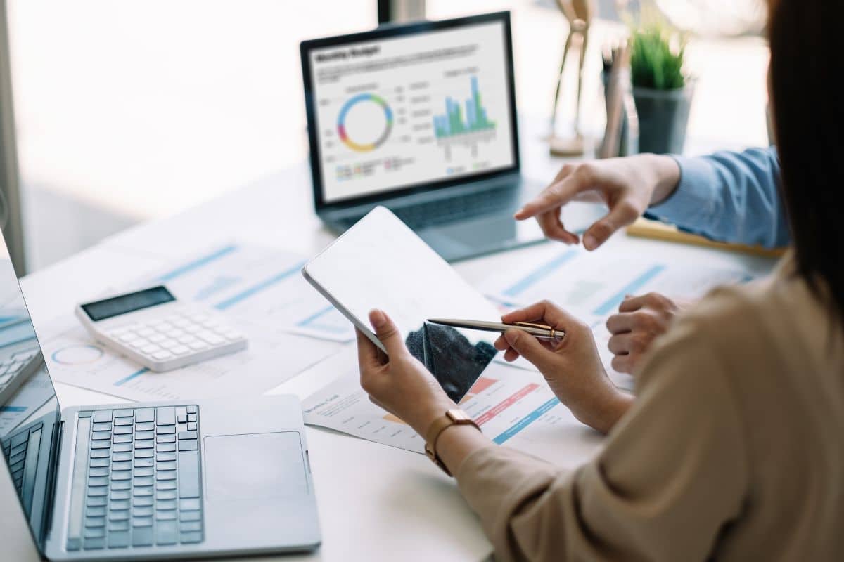 Underwriting team reviewing a lending dashboard